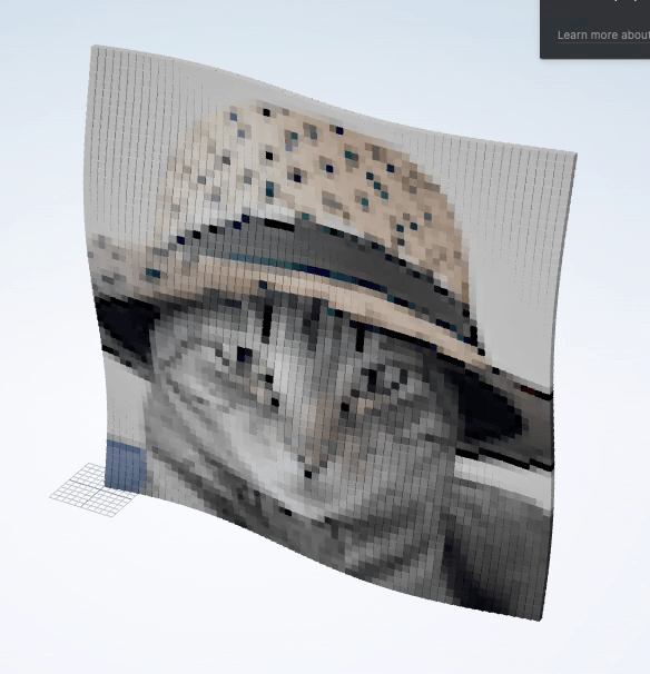 &ldquo;DALL-E generated image using the prompt cat in a hat, pixelated into THREE.js geometries&rdquo;